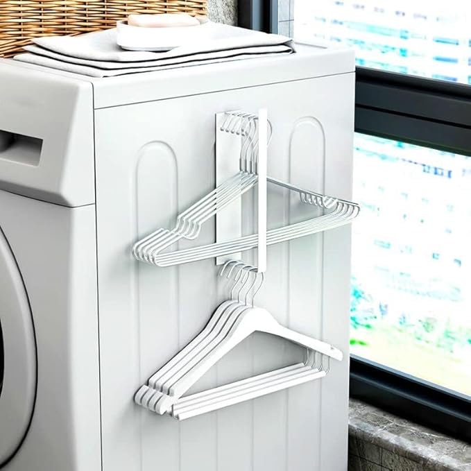 Magnetic hanger storage for side of washing machine 